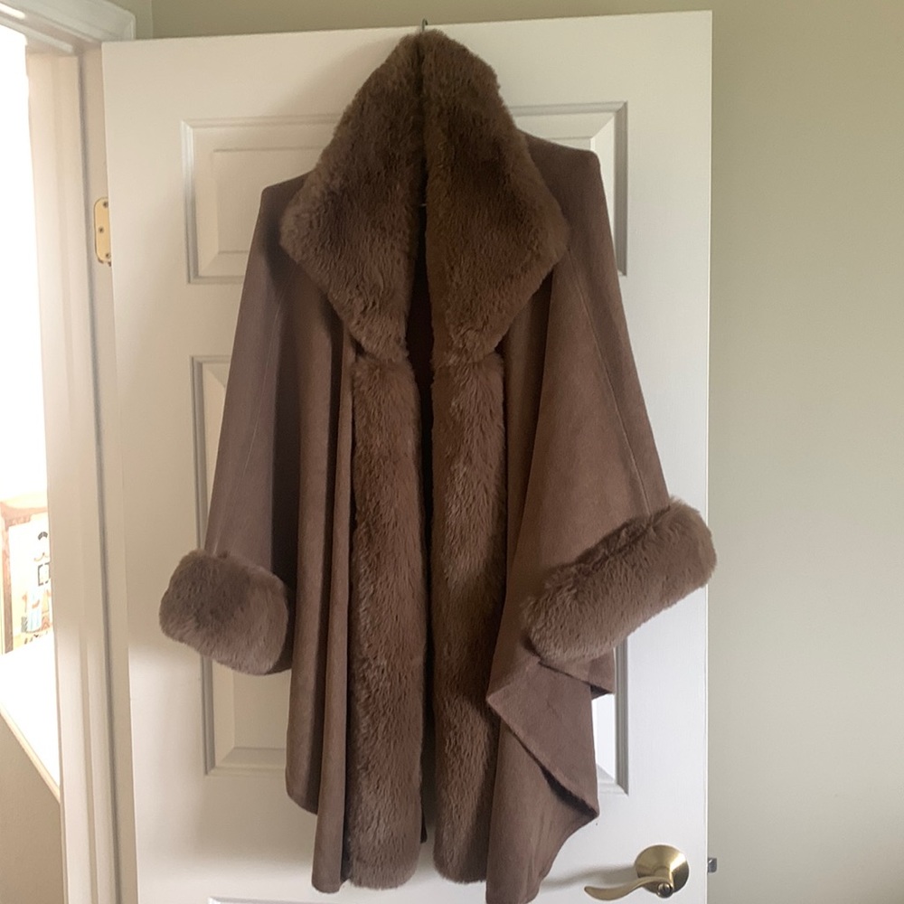 Beautiful faux fur cape! New condition and only worn once.